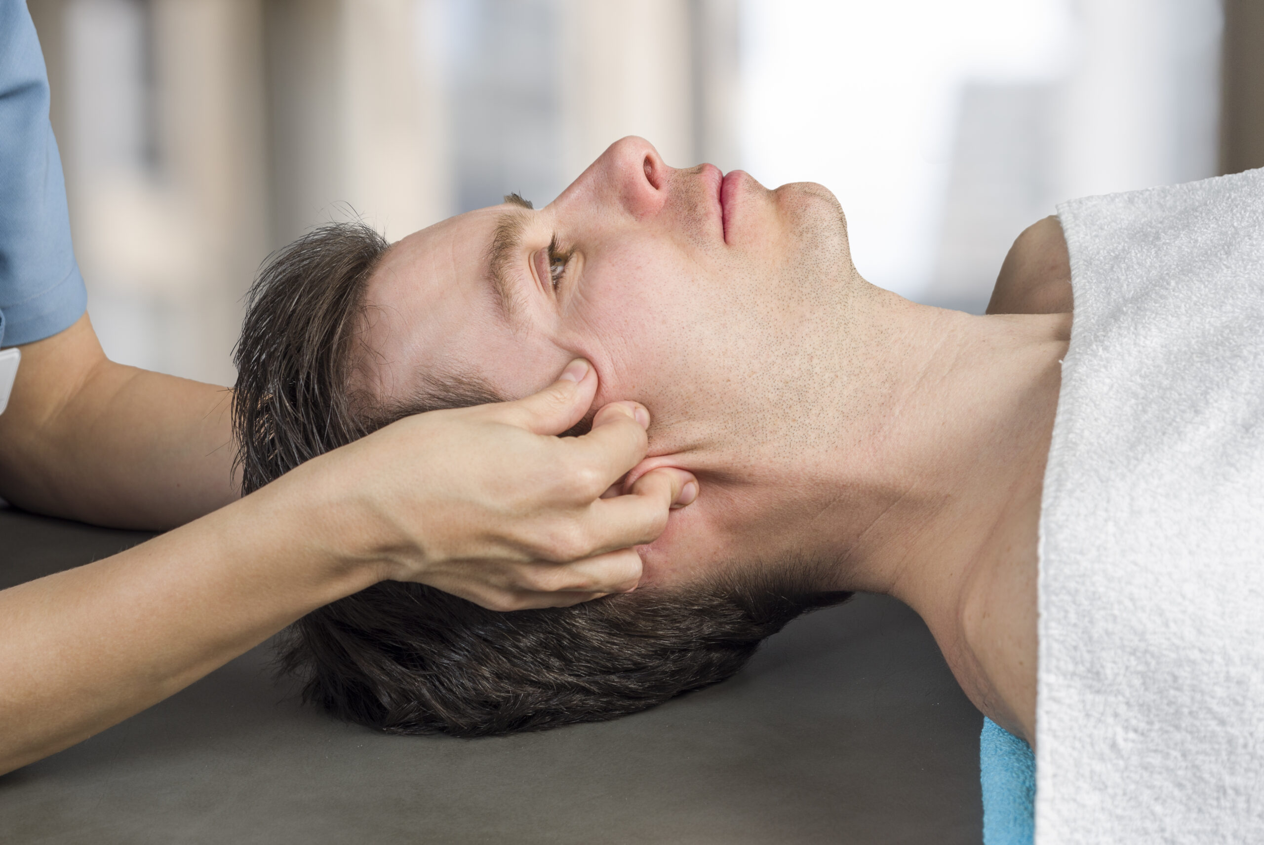 Male receiving intense chiromassage near crows peaks